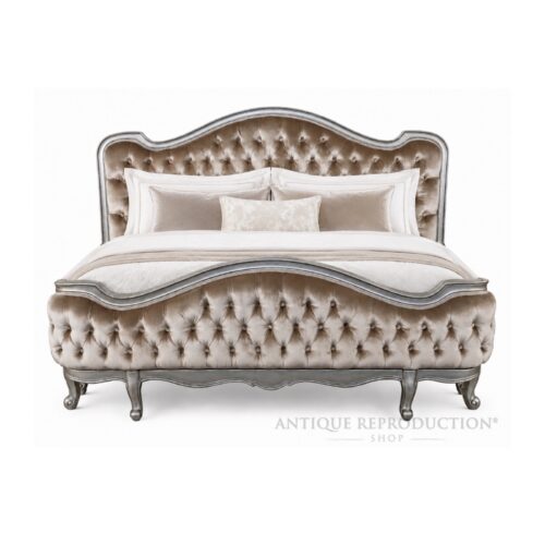 Silver-finish Chantilly French Provincial upholstered bed frame with champagne button-tufted headboard and footboard.