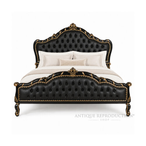 Black tufted Empire Baroque upholstered bed frame styled with bedding, featuring ornate solid mahogany carving