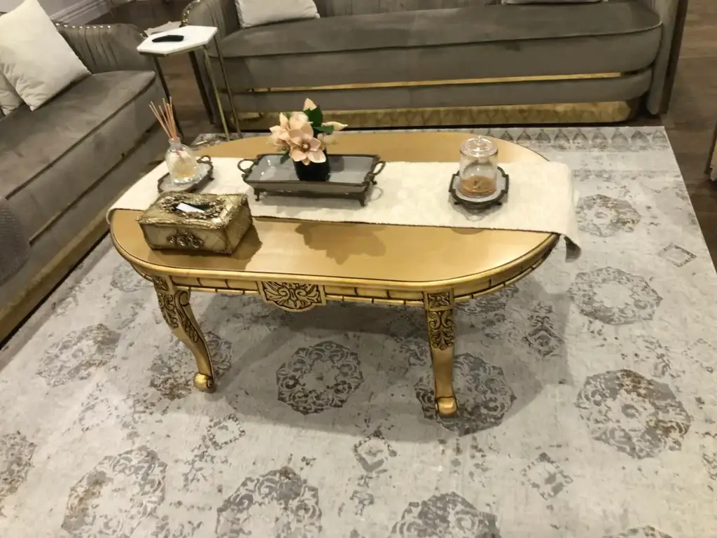 This is a photo of the Rococo Baroque lounge suite in antique gold, styled as a grand living space