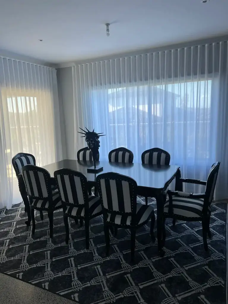 This is an image of a Black & White dining set with a skull on the table, black gothic in Mickleham Victoria