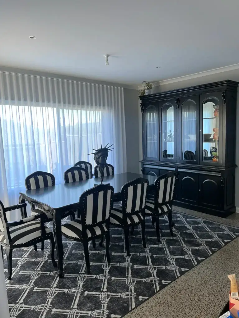 This is an image of Black & White French Provincial style chairs on a bones rug on a polished concrete floor, through The Antique Reproduction Shop in Lilydale VIC