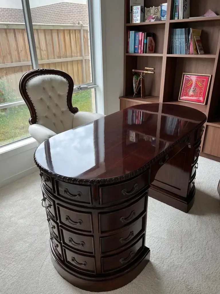 This is an image of a custom Chippendale style desk in high gloss mahogany, handcrafted by The Antique Reproduction Shop copy