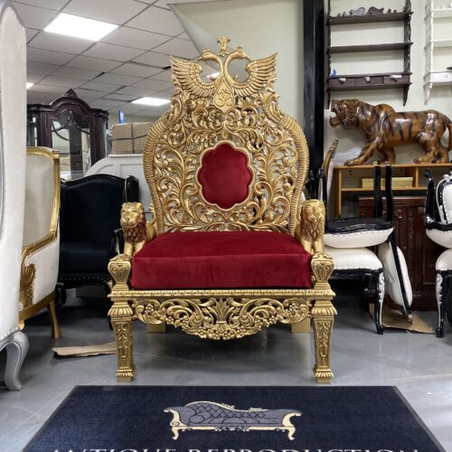 Grand red and gold Guruji Singhasan chair with Om symbol, peacock crest and carved lion arms