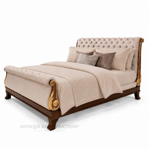 Chatsworth upholstered mahogany sleigh bed with hand-carved gilded detailing