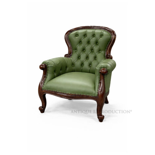 Green grandfather chair with buttoned synthetic leather upholstery and solid mahogany frame