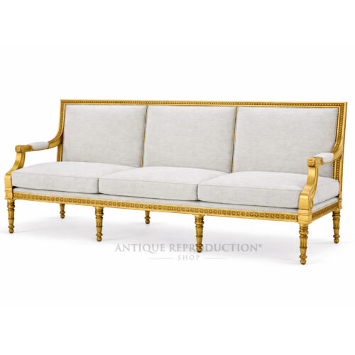 Versailles French gold sofa with neutral upholstery, fluted legs and carved solid mahogany frame